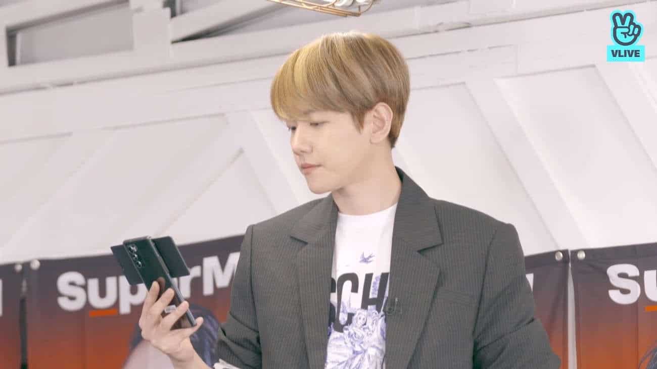 Baekhyun of EXO and SuperM holding a LG WING phone